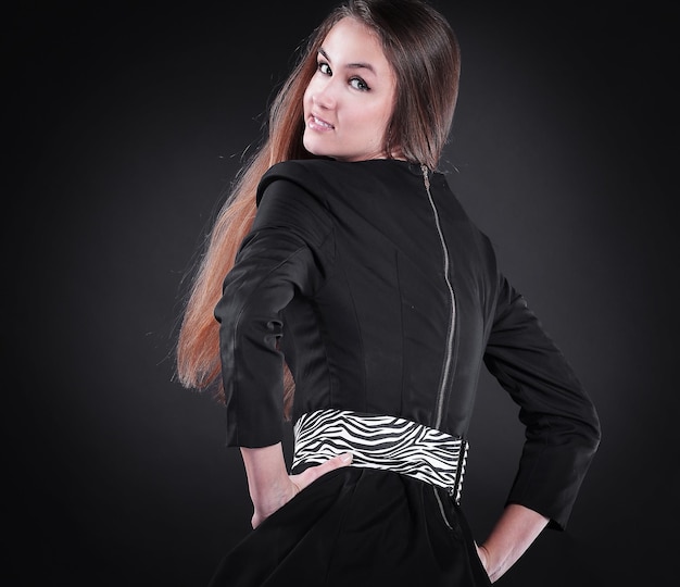 Portrait of stylish young woman in black dress