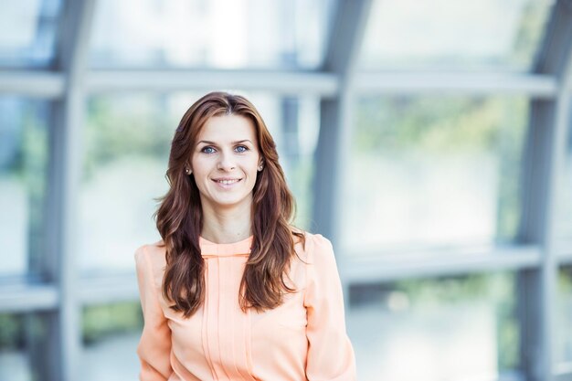 Portrait of successful business woman on the background of the spacious office