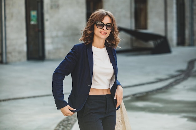 Portrait of a successful business woman in front of modern business building Young manager outside