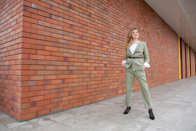 Portrait of a successful business woman in front of modern business building Young manager poses