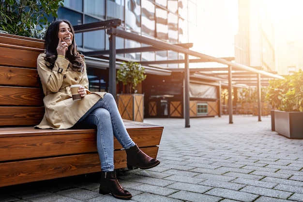 Portrait of successful business woman holding cup of hot drink