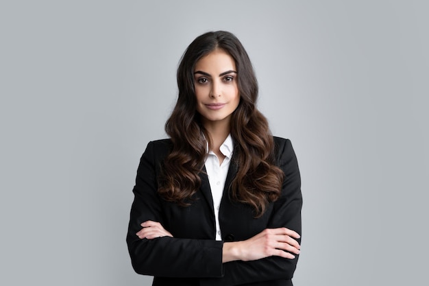 Portrait of successful business woman in suit on gray isolated background Female office worker success manager Serious office female worker manager employees