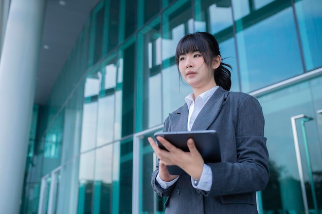 Portrait of a successful business womanBeautiful Woman Going To Work Walking Near Office Buildingprofessional entrepreneur standing in office clothing