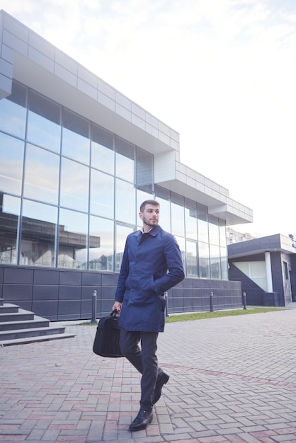 Portrait of successful businessman on the street