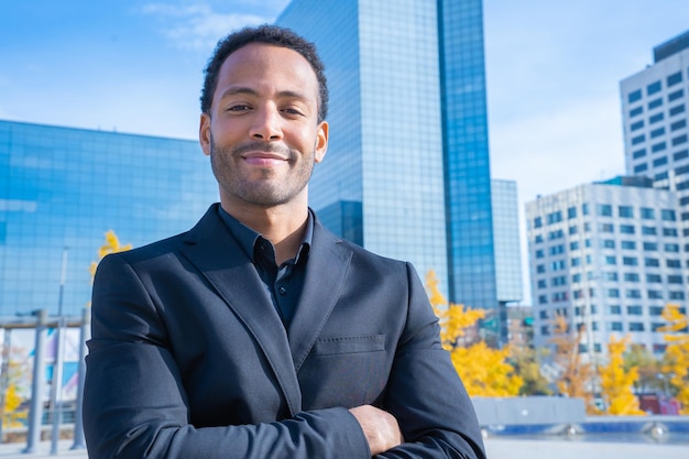 Portrait of successful smiling african american businessman in suit smiling looking at camera