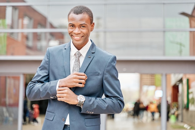 Portrait of successful smiling cheerful african american businessman executive stylish company leader