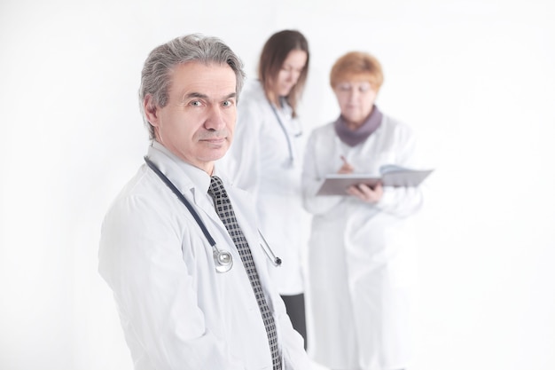 Portrait of a successful therapist doctor on blurred background of colleagues