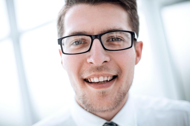 Portrait of a successful young businessman with glasses