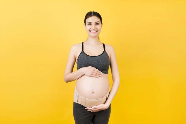 Portrait of supporting bandage on pregnant woman