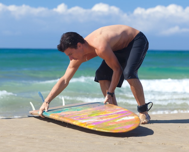 Portrait of Surfer with longboard