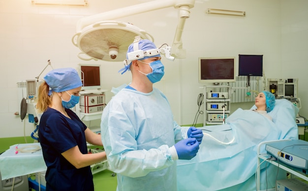 Portrait of surgeon in modern procedure room. Background