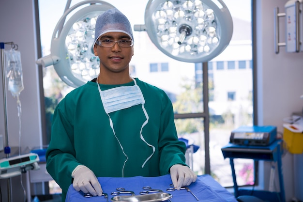 Portrait of surgeon standing in operation room