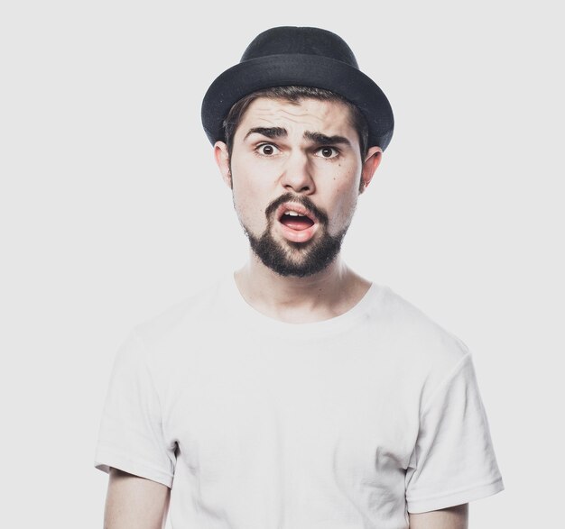 Portrait of surprised bearded man against white background