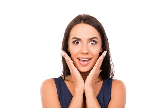 Portrait of surprised happy  young woman on white background