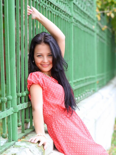 Portrait of sweet young woman enjoying at the park - Outdoor