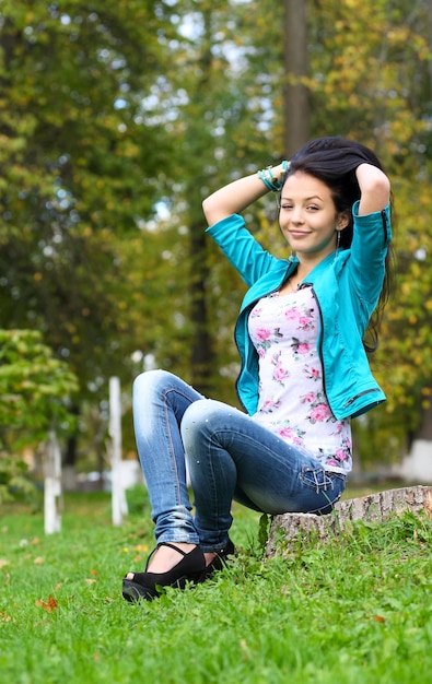 Portrait of sweet young woman enjoying at the park - Outdoor