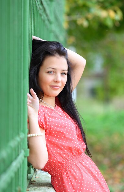 Photo portrait of sweet young woman enjoying at the park - outdoor