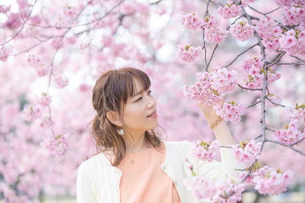 Portrait taken under a cherry tree in full bloom