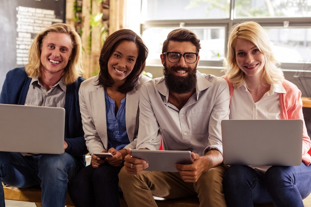 Portrait of a team of hipsters with laptop