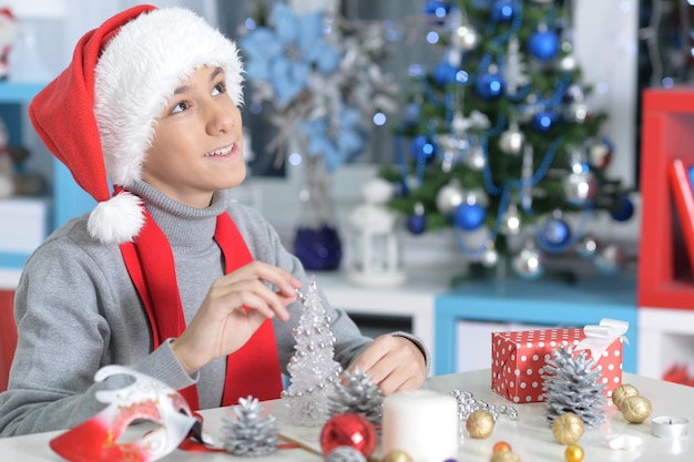Portrait of teen boy preparing for Christmas at home