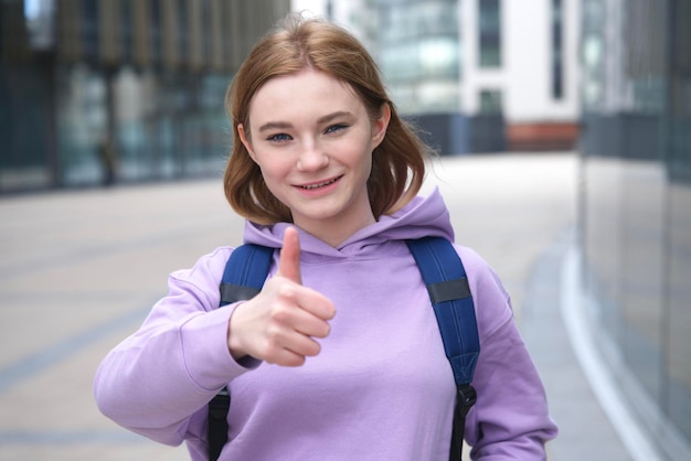 Portrait of teen teenager young happy girl beautiful academic college or university student pupil