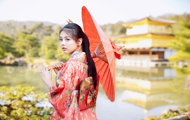 Portrait of teenage girl holding umbrella