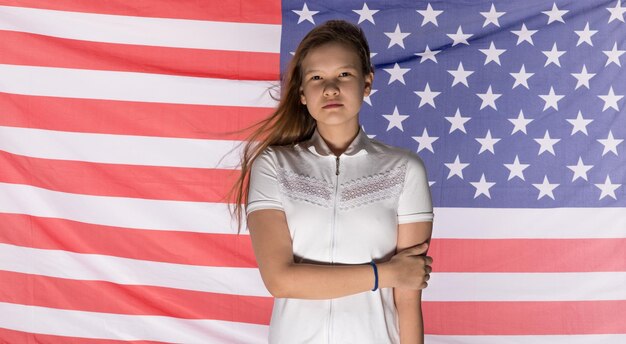 portrait of teenage girl with american flag