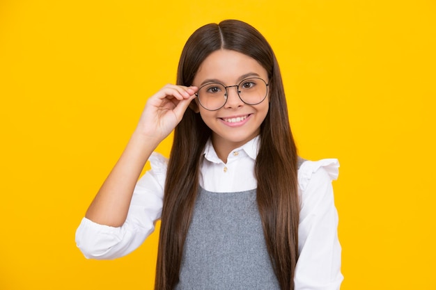 Portrait of teenager child girl in glasses Kid at eye sight test Girl with eyeglasses and looking at camera Vision for children Happy girl face positive and smiling emotions