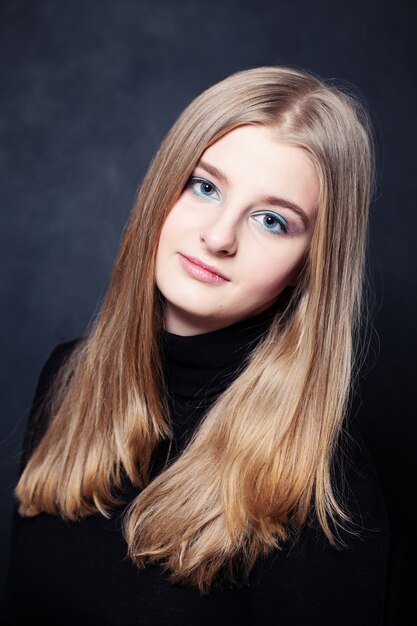 Portrait of Teenager Girl with Long Blonde Hair. Young Beauty