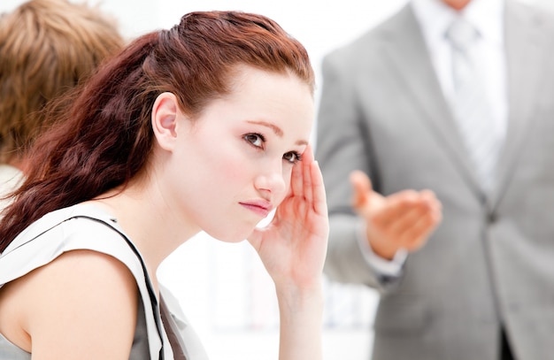 Portrait of a thinking businesswoman during a meeting 