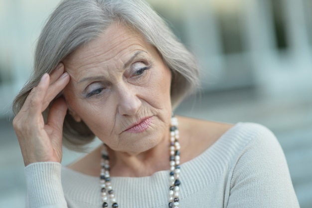 Portrait of a thinking elderly woman close-up