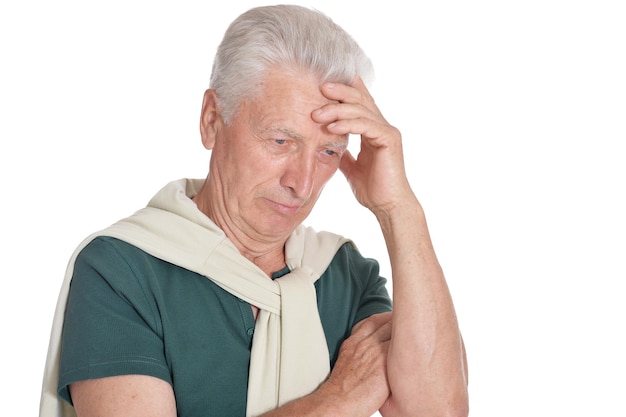 Portrait of thinking senior man on white background