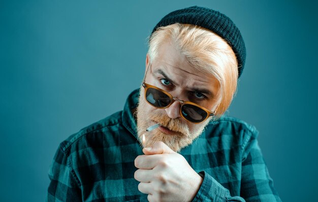 Portrait of thinking stylish young man looking away handsome man with a beard