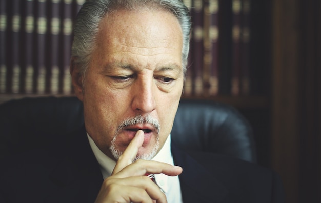 Portrait of a thoughtful manager in his office