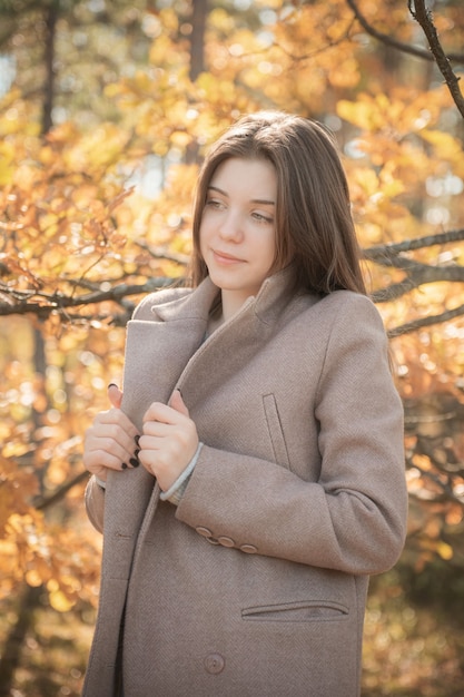 Portrait of a thoughtful and sad girl. Autumn colors . Lifestyle. Autumn mood. Forest