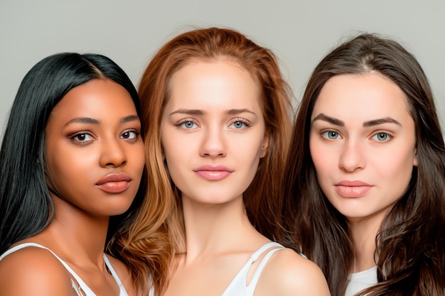 Photo portrait of three beautiful 20yearold women of different races