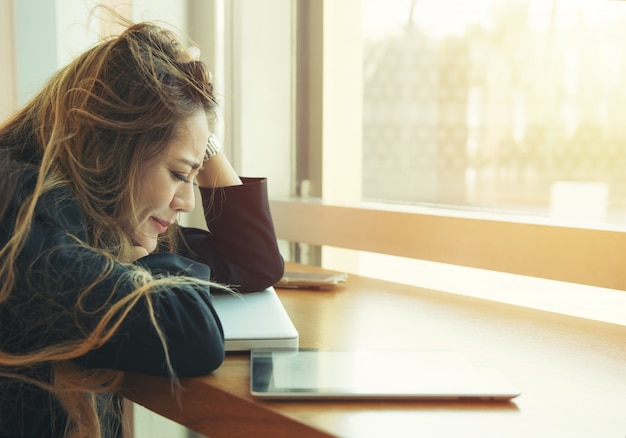 Portrait of tired young business asia woman