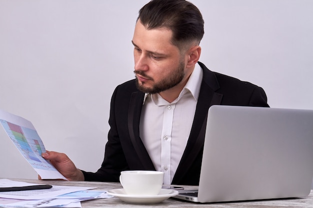 Portrait of trader exploring currency charts