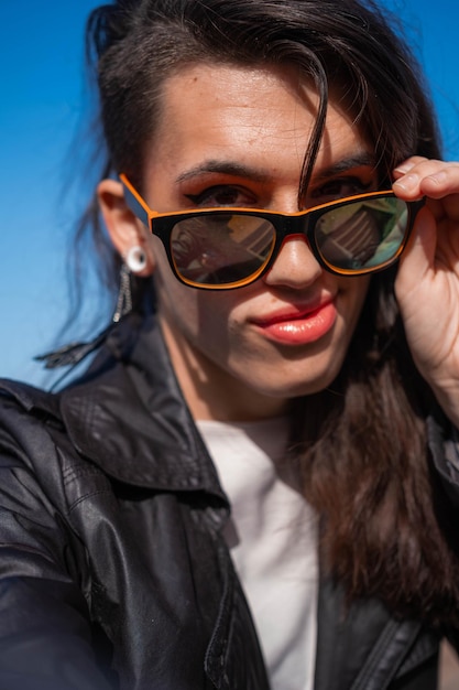 Portrait of a transgender woman wearing sunglasses LGTBIQ activism
