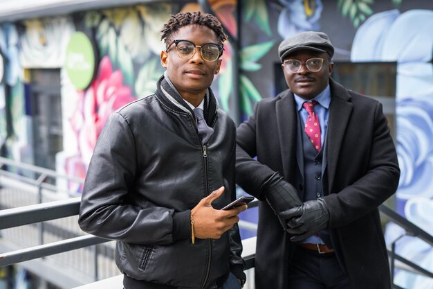 portrait of two african friends in stylish clothes