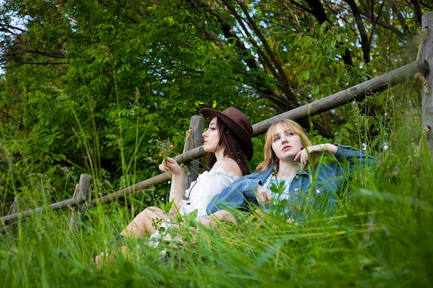 Portrait of two beautiful girls on the nature. Soft focus