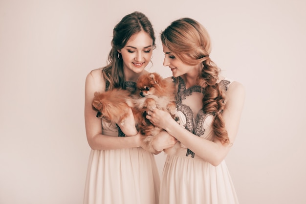 Portrait of two beautiful womenwith their Pets 