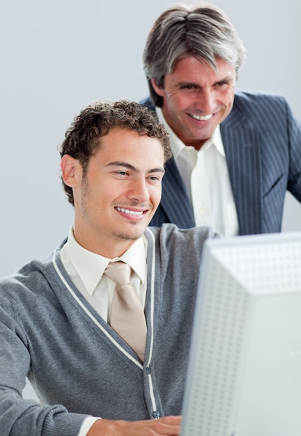 Portrait of two business colleagues working at a computer