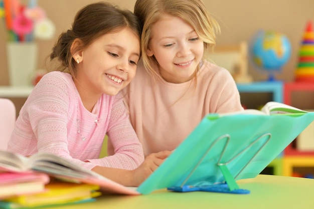 Portrait of two girls with their homework