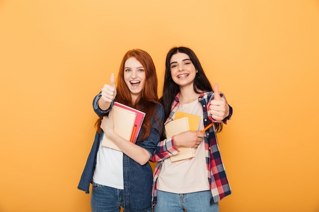 Portrait of two happy young school women