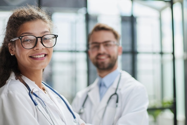 Portrait of two medical workers in the hospital looking at the camera