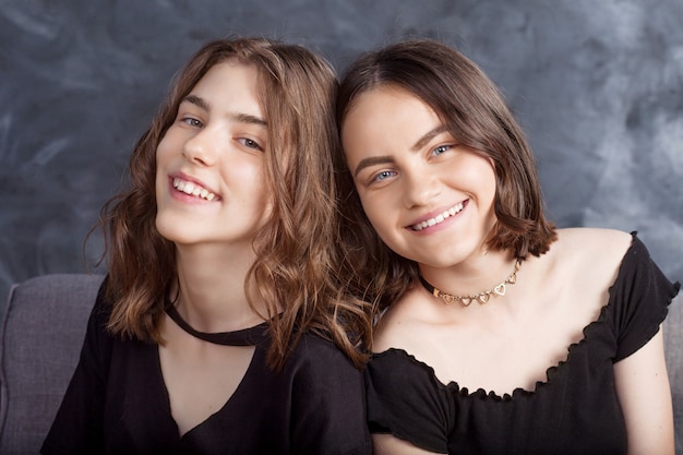 Portrait of two  smiling teenage girls. 