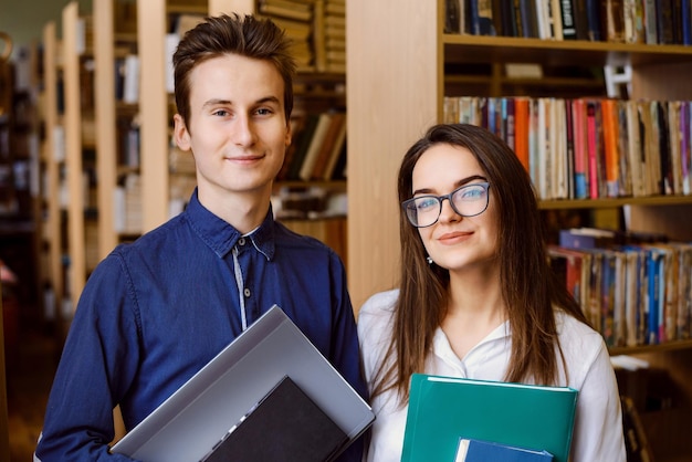 Portrait of two students in the library University students studying in the library