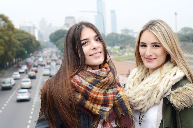 Portrait of two young woman. Urban concept.