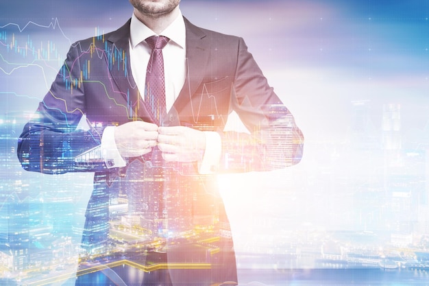 Portrait of an unrecognizable businessman buttoning his suit while standing against a city panorama. Toned image, double exposure